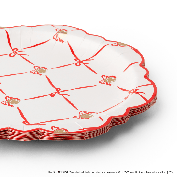 Stack of decorative paper plates with red and gold patterns on a white background