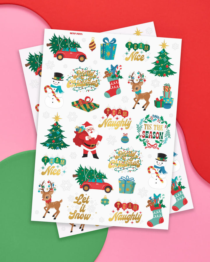 Two sheets of naughty or nice Christmas temporary tattoos with Santa, reindeer, trees, and gold foil lettering