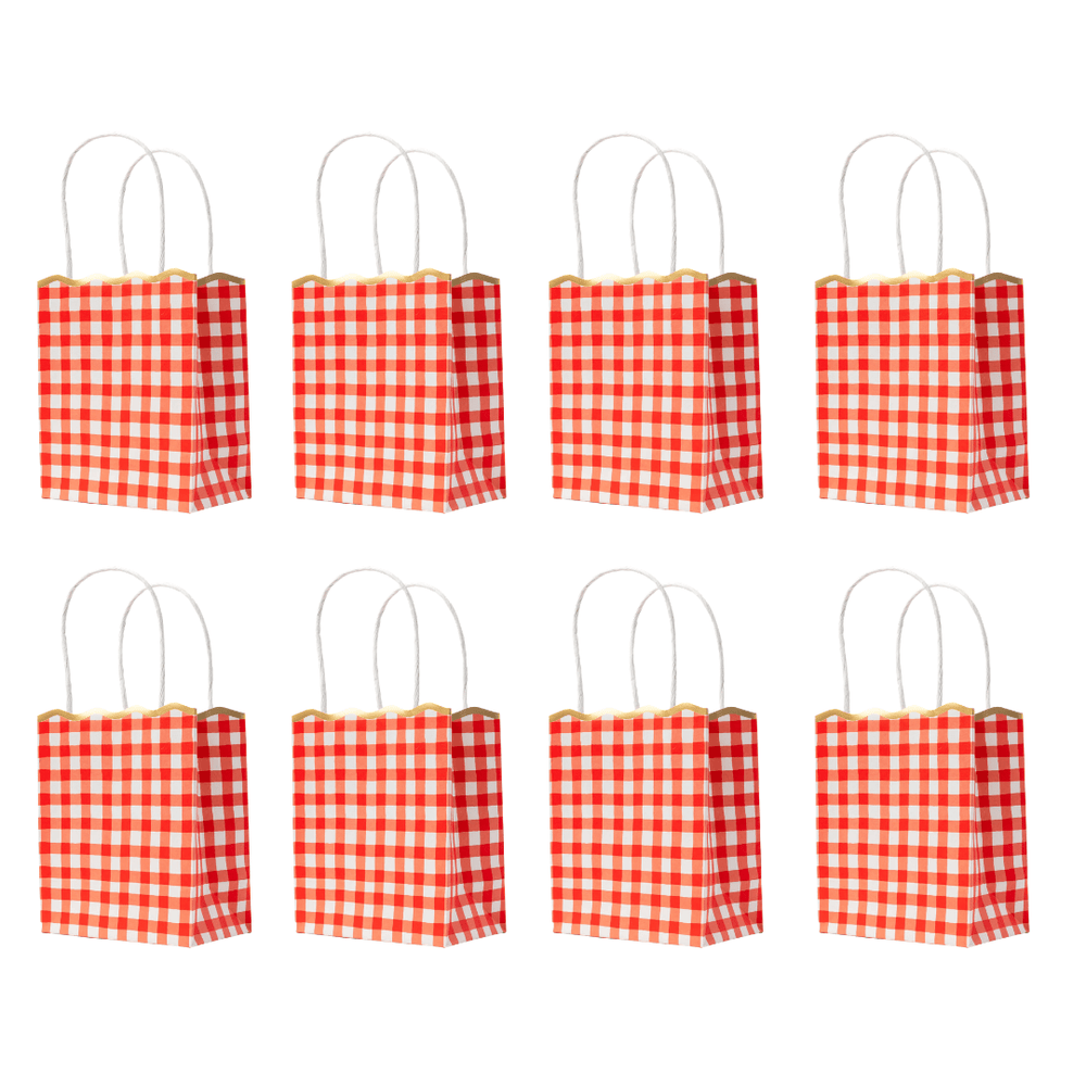 Eight small red and white checkered paper gift bags with white handles, arranged in two rows of four on a plain white background.