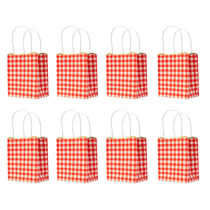 Eight small red and white checkered paper gift bags with white handles, arranged in two rows of four on a plain white background.