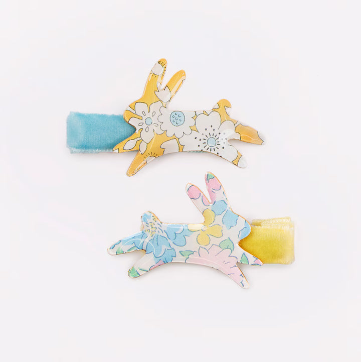Two Meri Meri x Liberty floral bunny hair clips with light blue and yellow velvet ribbons.