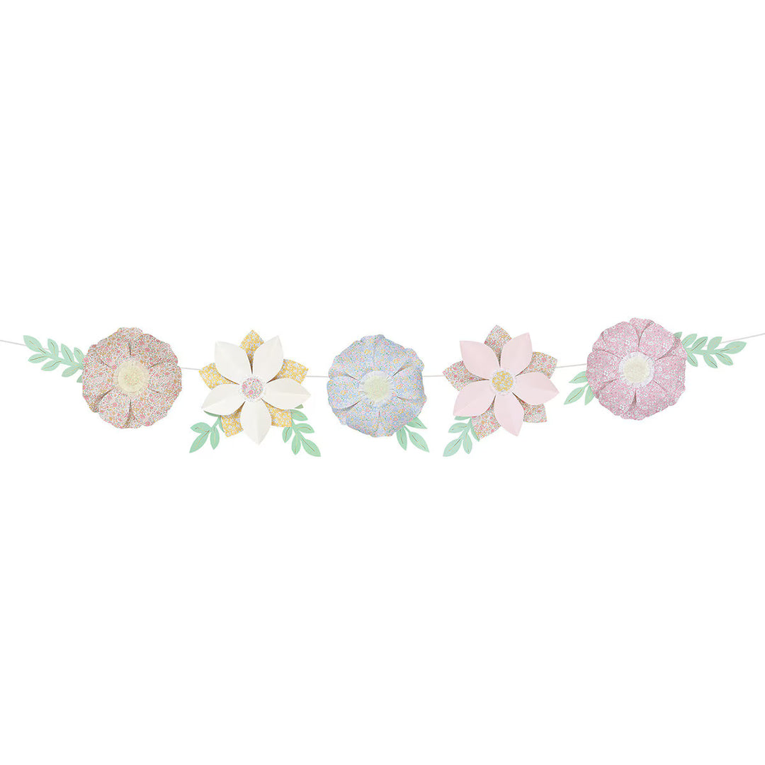 Meri Meri x Liberty paper flower garland with pastel floral-print petals, fringed centers, and paper leaves.