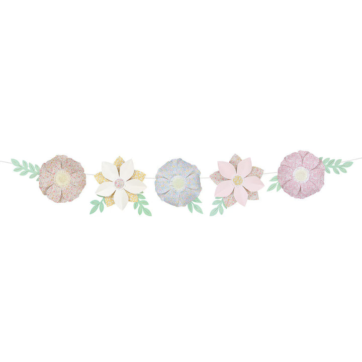 Meri Meri x Liberty paper flower garland with pastel floral-print petals, fringed centers, and paper leaves.