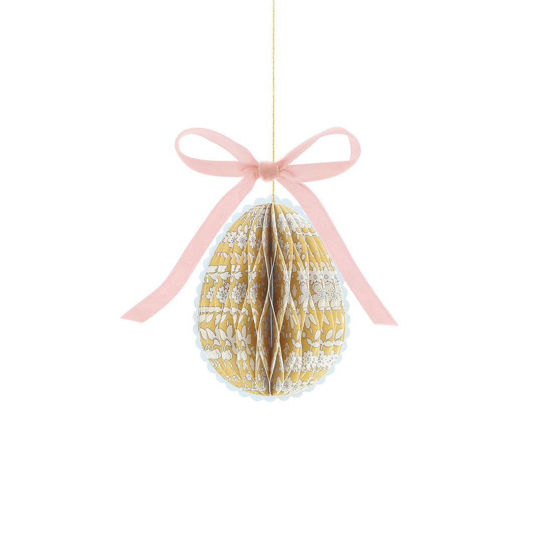 Yellow floral honeycomb egg from the Meri Meri x Liberty mini Easter decoration set, with a pink velvet bow.