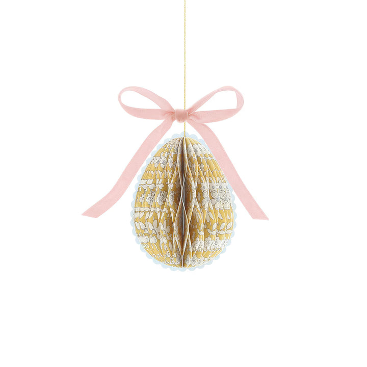 Yellow floral honeycomb egg from the Meri Meri x Liberty mini Easter decoration set, with a pink velvet bow.