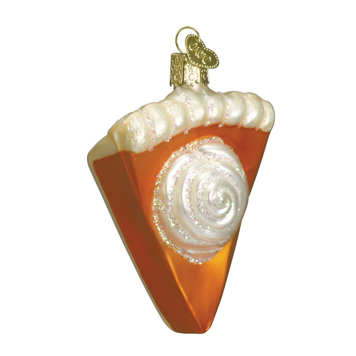 Pumpkin pie slice ornament front view, orange filling with a whipped cream swirl, on white
