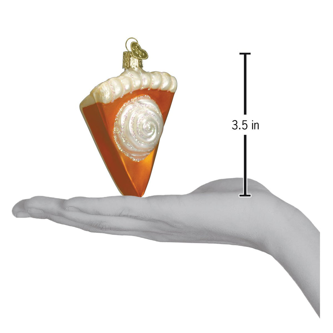 Pumpkin pie ornament on an open palm beside a 3.5 inch height marker