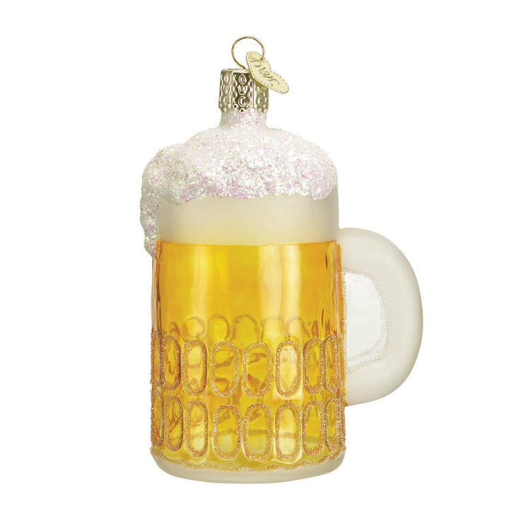 Mug of beer glass ornament, front view, golden dimpled mug with frothy white foam on white