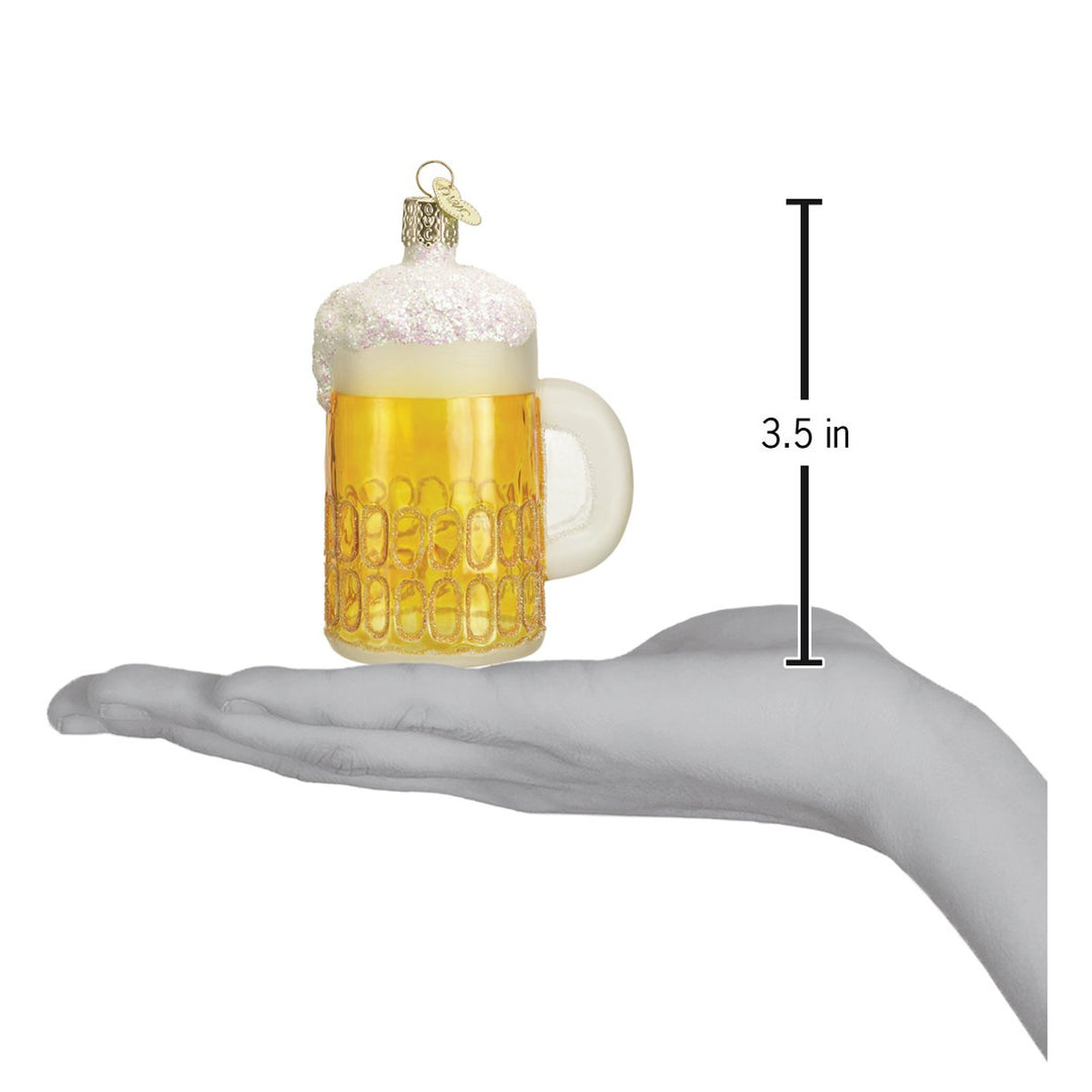 Mug of beer ornament resting on a hand with a 3.5 inch height marker for scale