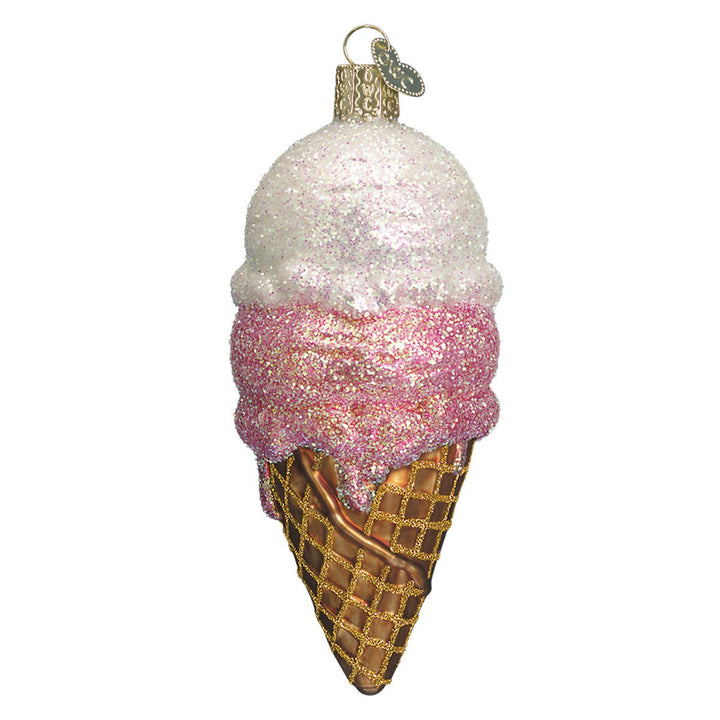 Ice cream cone ornament front view, white scoop over pink scoop in a waffle cone, on white