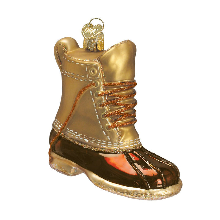 Field boot ornament with tan upper, copper laces, and glossy brown rubber foot, side view on white