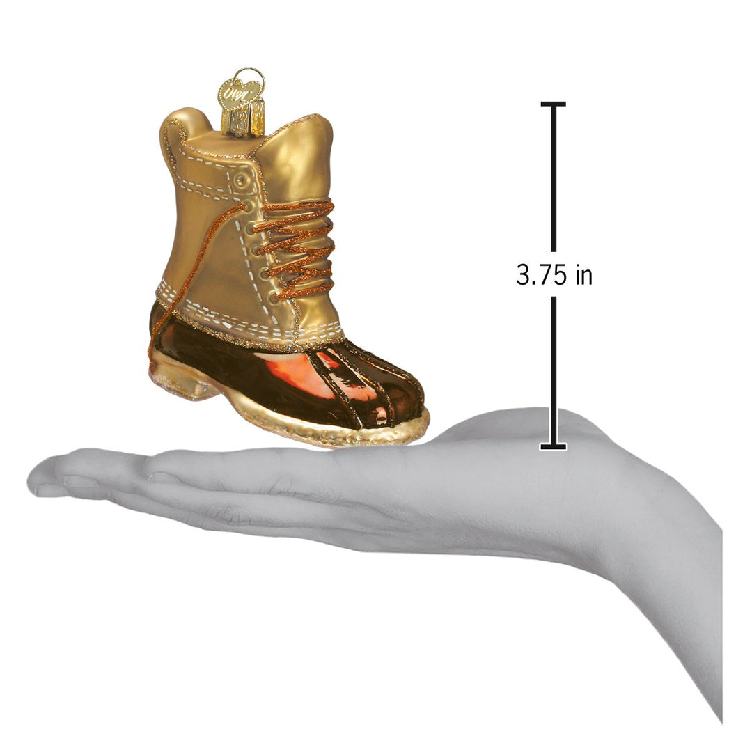 Field boot ornament on an open palm beside a 3.75 inch height marker