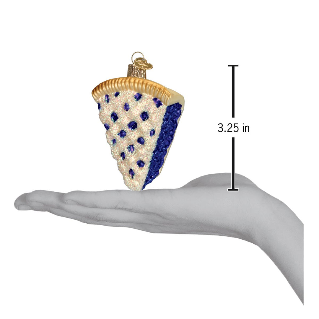 Blueberry pie ornament on an open palm beside a 3.25 inch height marker
