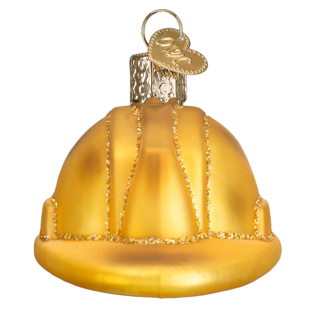 Front of the golden yellow construction hard hat ornament with glittered ridges and brim, on white