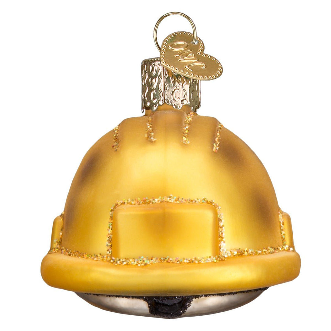 Back of the yellow hard hat ornament with a glimpse of the dark underside, on white