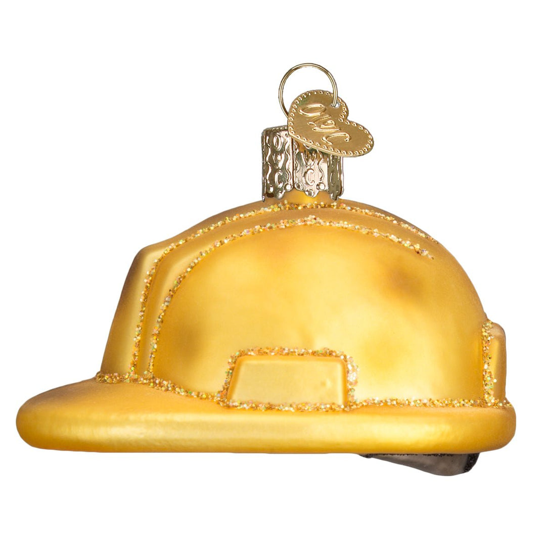 Side profile of the hard hat ornament showing the front brim and raised ridges, on white