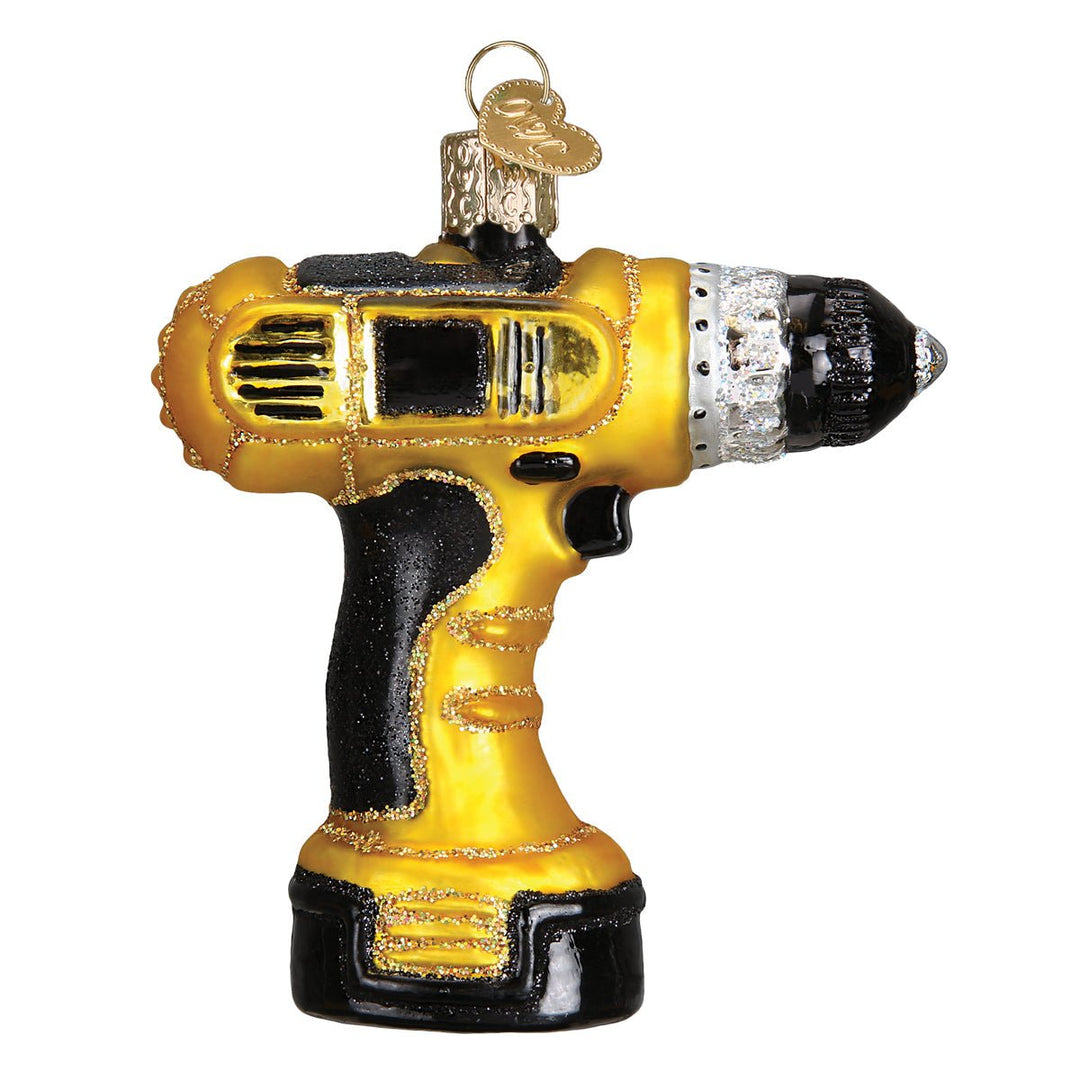 Yellow and black power drill ornament hanging on a lit Christmas tree
