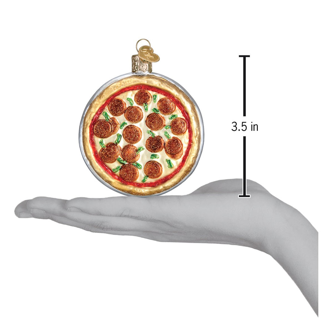 Pizza ornament on an open palm beside a 3.5 inch height marker
