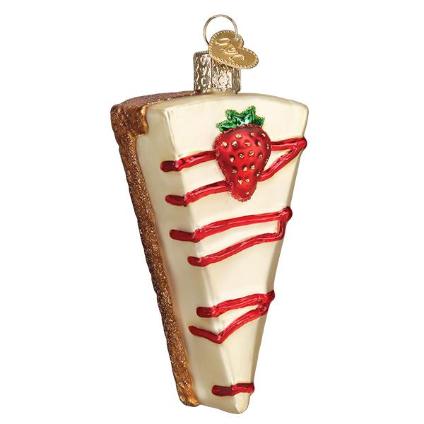Strawberry cheesecake slice ornament front view, red sauce drizzle and a whole strawberry, on white