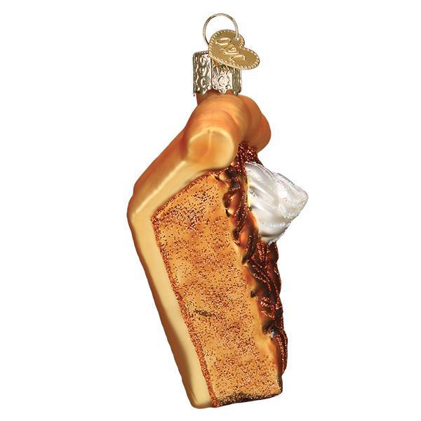 Pecan pie ornament side view, fluted crust and whipped cream peeking over the edge