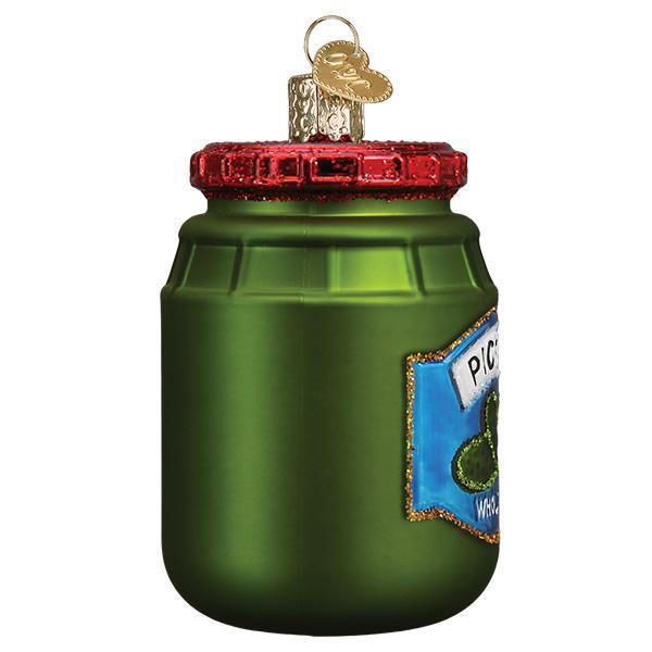 Side of the pickle jar ornament with the edge of the blue label, on white