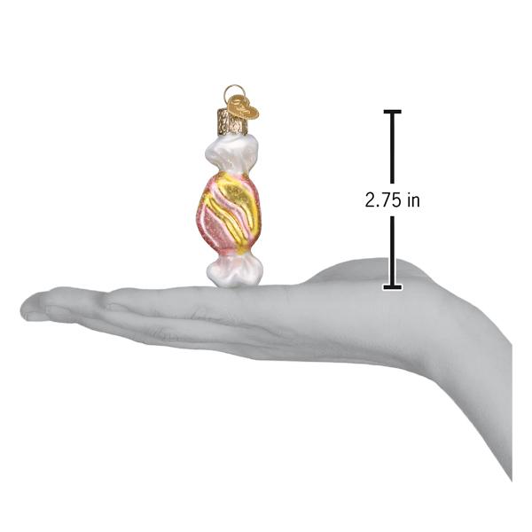 One salt water taffy ornament on an open palm with a 2.75 inch height marker