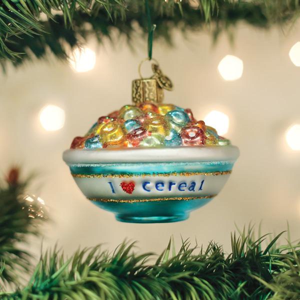 Bowl of cereal glass ornament hanging from a Christmas tree branch with glowing bokeh lights