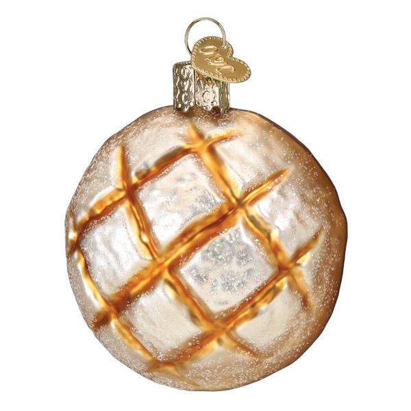 Sourdough bread ornament front view, round boule with crosshatch score and flour dusting, on white