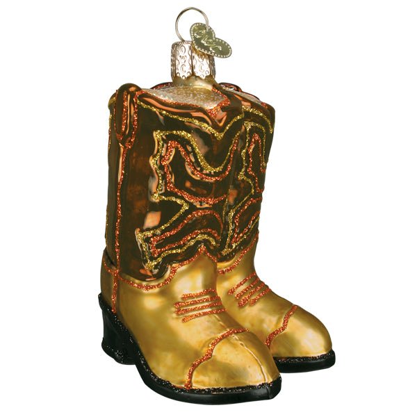 Pair of brown cowboy boots ornament with copper scroll stitching, tan toes, and black soles, on white