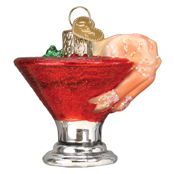 Shrimp cocktail ornament from the side, shrimp curled over the red coupe's edge