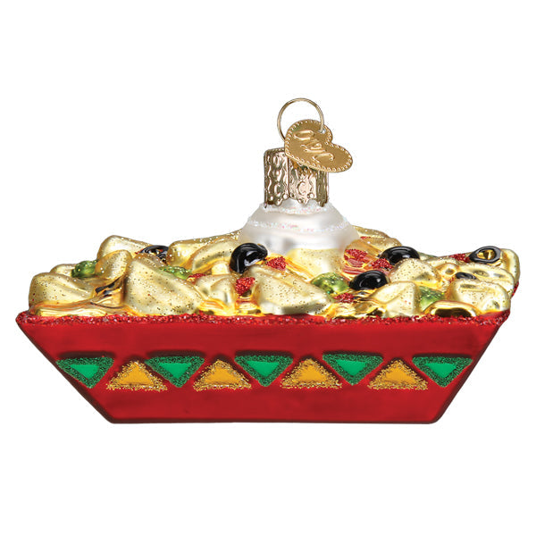 Nachos ornament with golden chips, black olives, and green peppers in a red triangle-pattern tray, front view