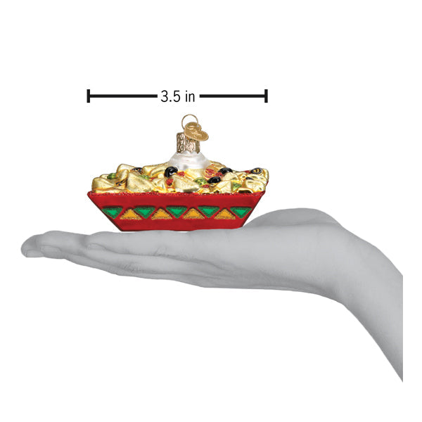 Nachos ornament on an open palm under a 3.5 inch width marker for scale