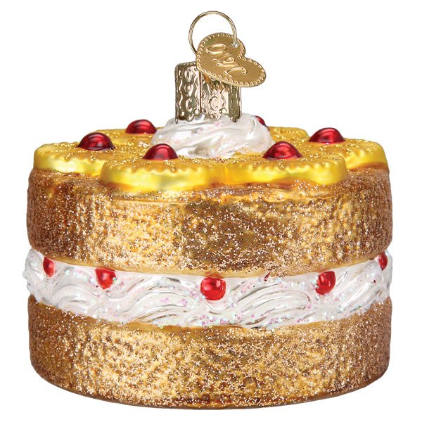 Pineapple upside down cake ornament front view, golden pineapple rings and red cherries on top, on white