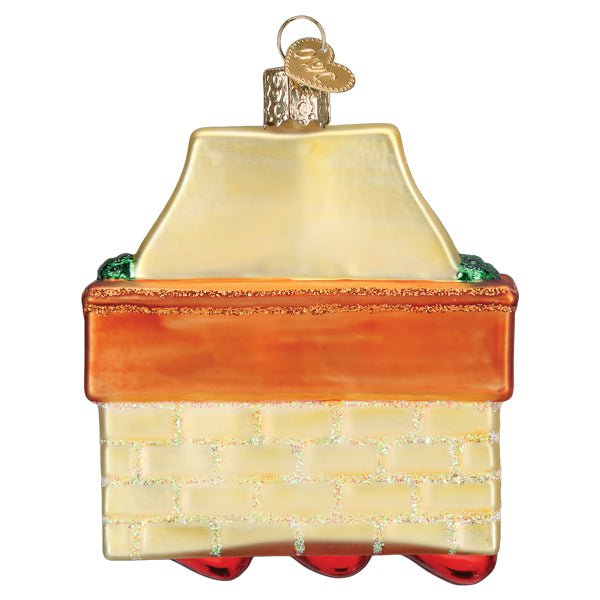 Back of the family of 3 stockings ornament showing the cream brick chimney and orange mantel, on white