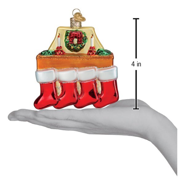 Family of 4 stockings ornament on an open palm beside a 4 inch height marker