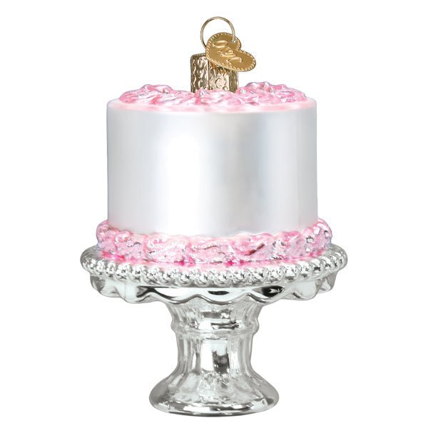 Back of the cake on stand ornament, smooth white frosting with pink trim on a silver pedestal
