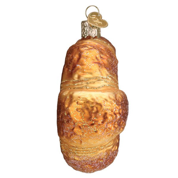 Croissant ornament seen end-on, a slim golden crescent with layered crust