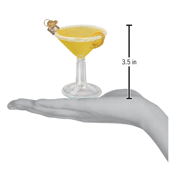 Lemon drop martini ornament on an open palm beside a 3.5 inch height marker