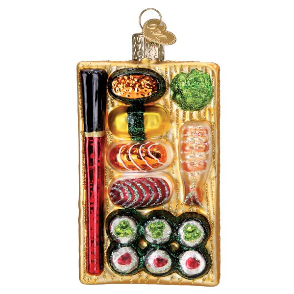 Sushi platter glass Christmas ornament with nigiri, maki rolls, shrimp, and red chopsticks on a gold board, front view