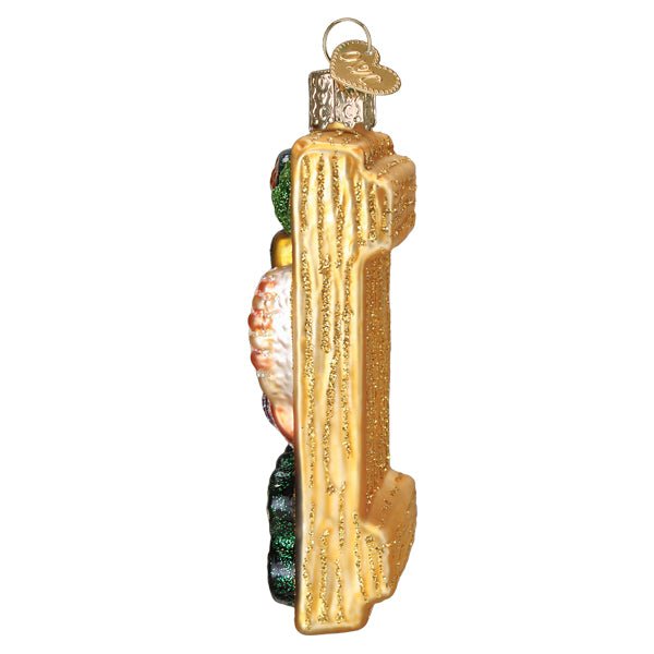 Side view of the sushi platter ornament showing the board edge and shrimp, on white