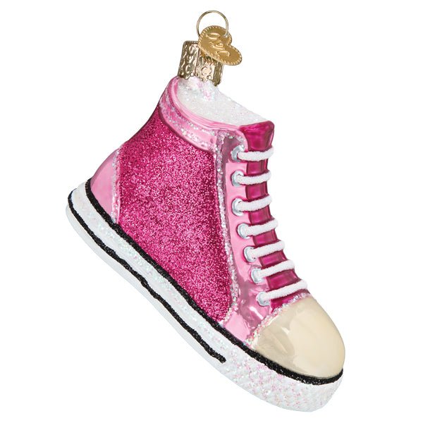 Pink glitter high top sneaker glass Christmas ornament with white laces and gold toe cap, side view on white