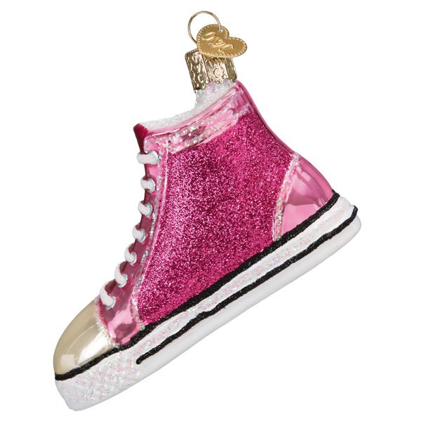 Opposite side of the pink high top sneaker ornament with the toe to the left, on white