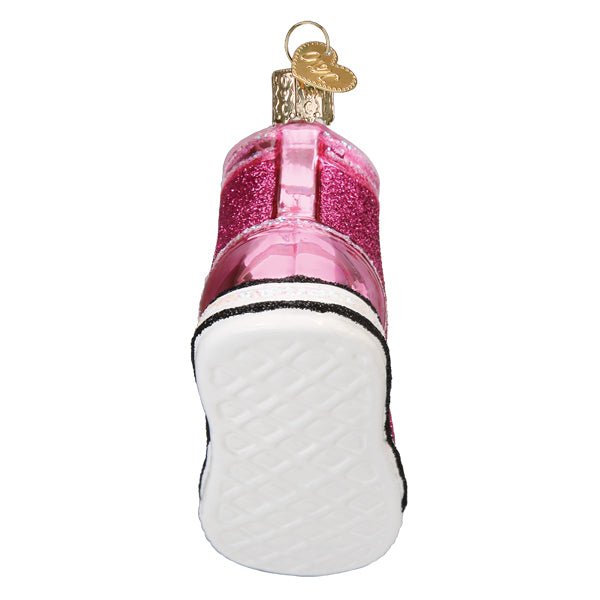Back of the pink sneaker ornament showing the white tread sole and heel, on white