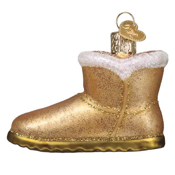 Opposite side of the tan sheepskin boot ornament showing its painted stitching, on white
