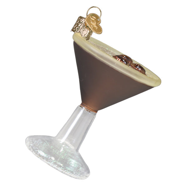 Espresso martini ornament tilted to show the coffee beans floating on the foam, on white
