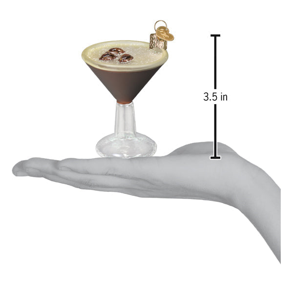 Espresso martini ornament on an open palm beside a 3.5 inch height marker