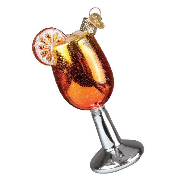 Aperol Spritz ornament in a silver stemmed glass with a citrus wheel garnish on the rim, on white