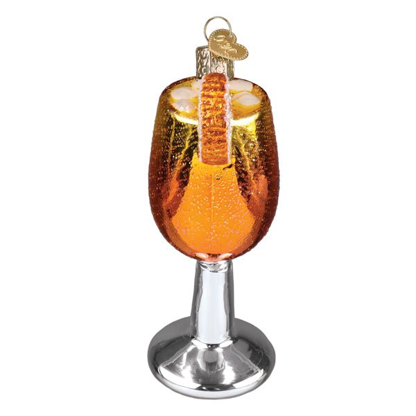 Back view of the glittered orange spritz ornament showing the silver stem and foot, on white