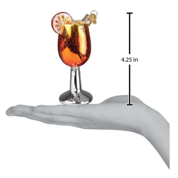 Aperol Spritz ornament on an open palm beside a 4.25 inch height marker