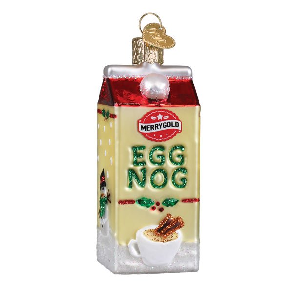 Front of the cream eggnog carton ornament with green glitter Egg Nog lettering and a cup of nog, on white